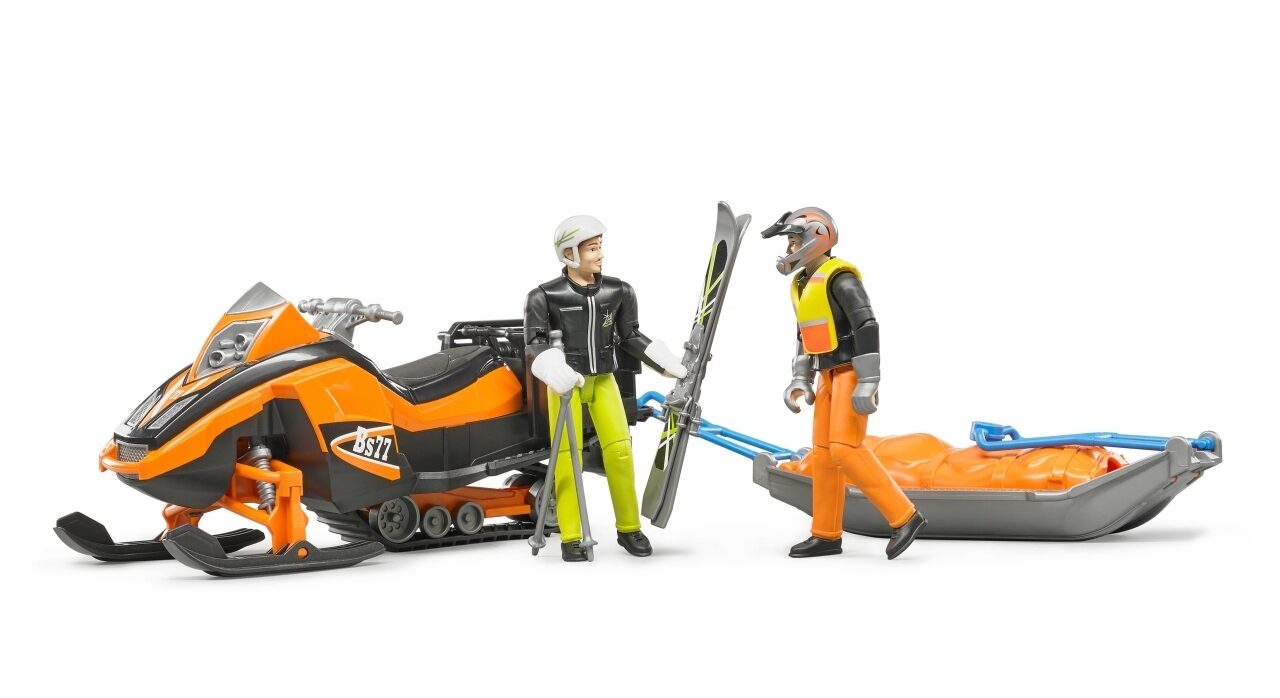 Snowmobil mit Fahrer und Akia Rettungsschlitten mit Skifahrer